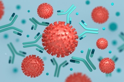 Coronavirus particles interacting with antibodies © GettyImages/DariaRen